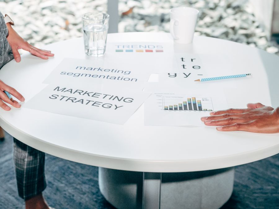 People discuss strategy documents — stock photo for Suggest a Color Palette