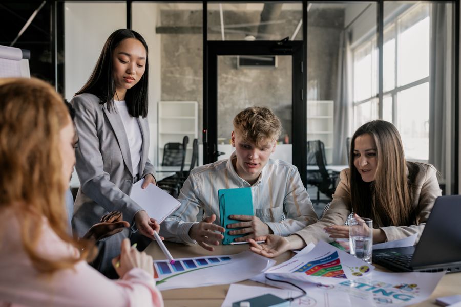 A group of people having a meeting in the office — Presentations in use