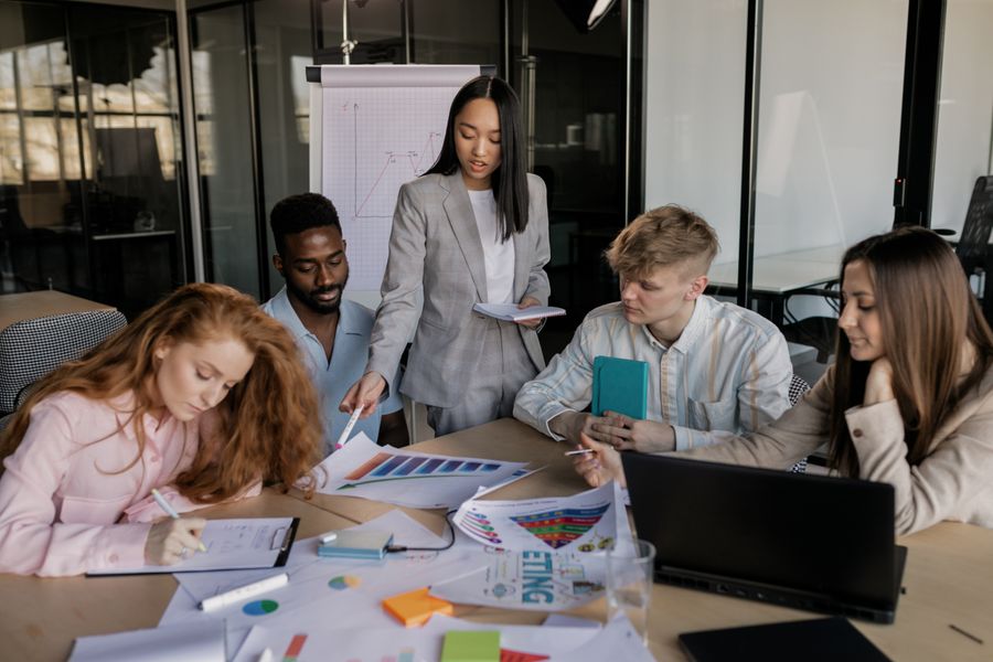 Colleagues having a business meeting — Create a Design browser mockup
