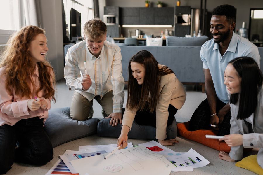 A group of people having a meeting in the office — Create a Design template-card mockup