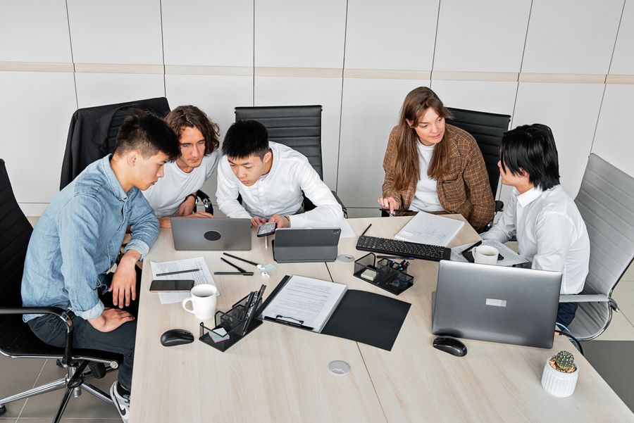 A group of people discussing in an office — Documents templates dashboard mockup