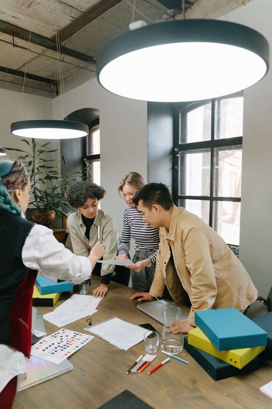 Colleagues having a discussion — Every photoaicompany design tool